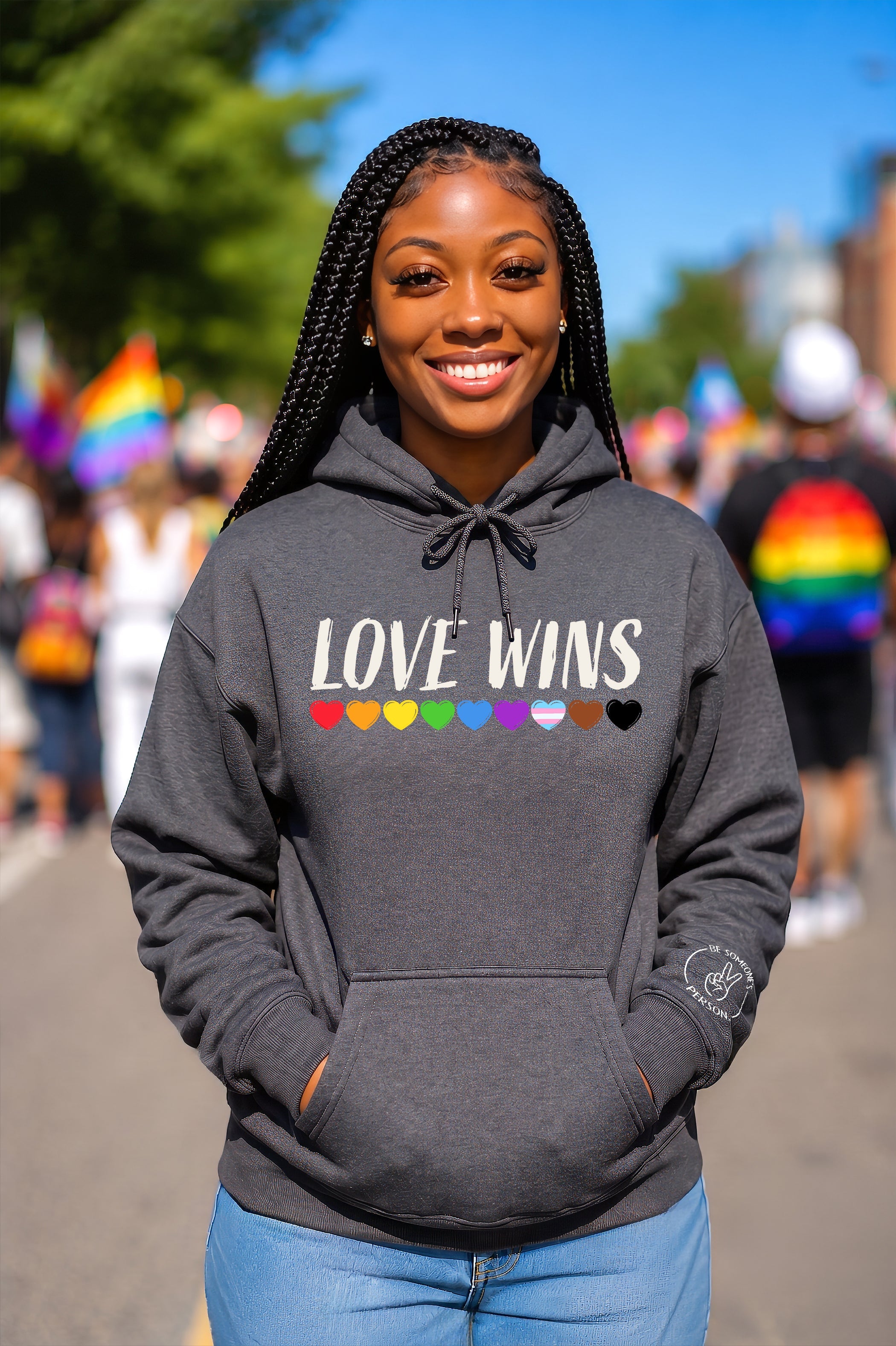 Love Wins LGBTQ+ pride hoodies and t-shirts featuring a spectrum of hearts, created by content creators Kayla and Samantha for Be Someone's Person.